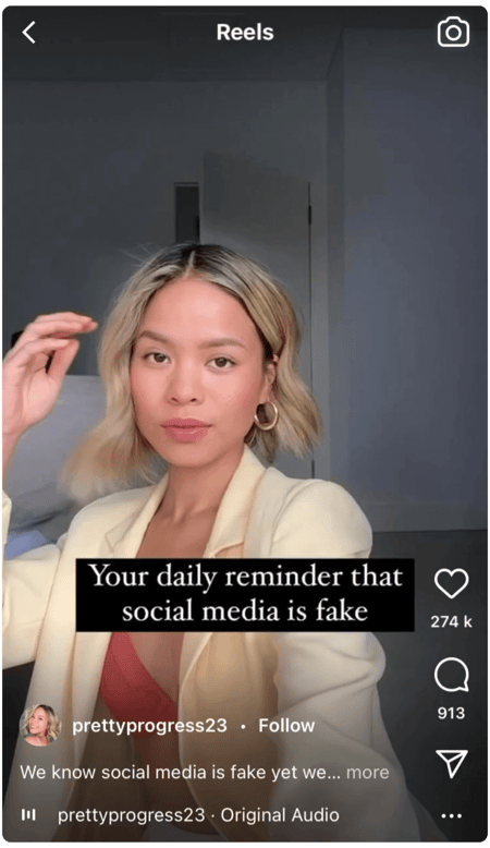 Screenshot of an Instagram reel feeaturing a person with a text overlay "Your daily reminder that social media is fake'
