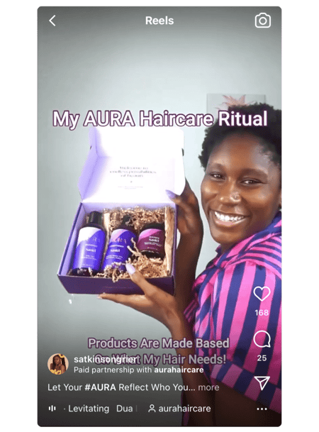 Screenshot of an Instagram Reel of a woman holding a box of hair products
