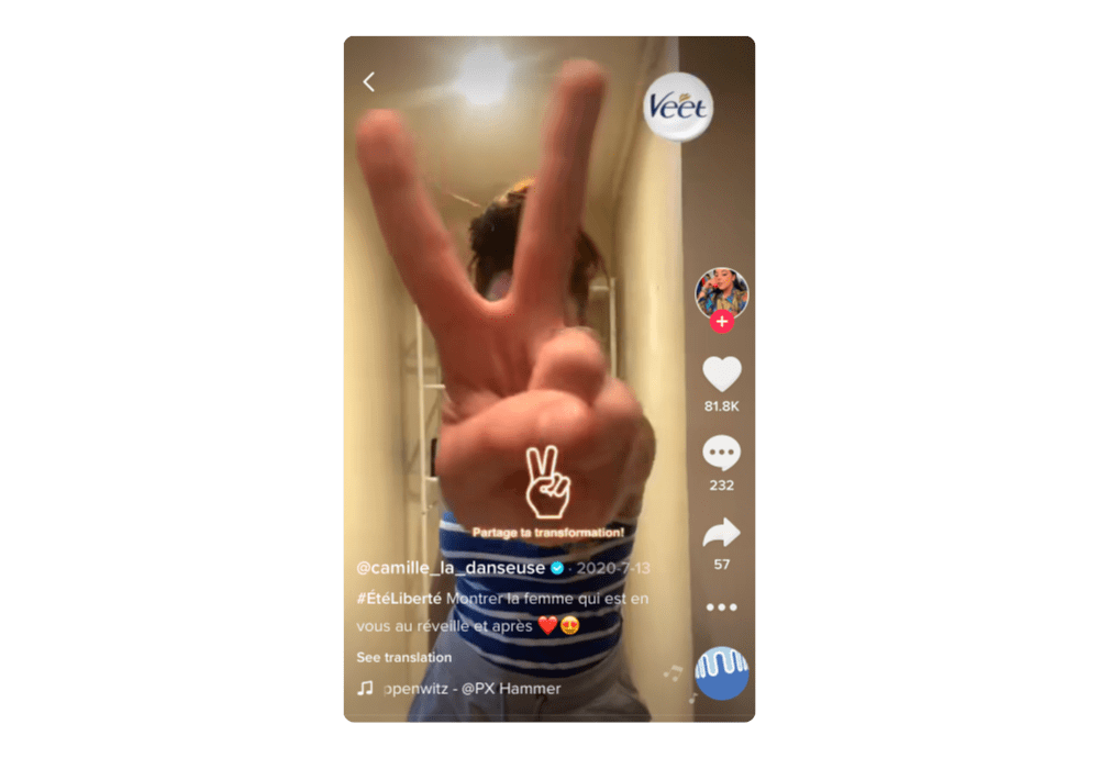 TikTok screenshot, person holds their hand in a peace sign towards the camera