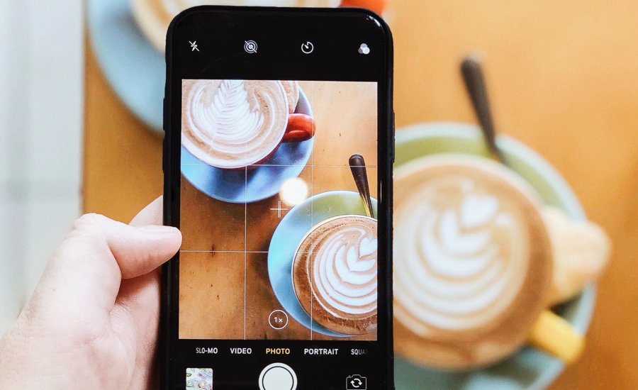 An iPhone screen taking a photo of coffee