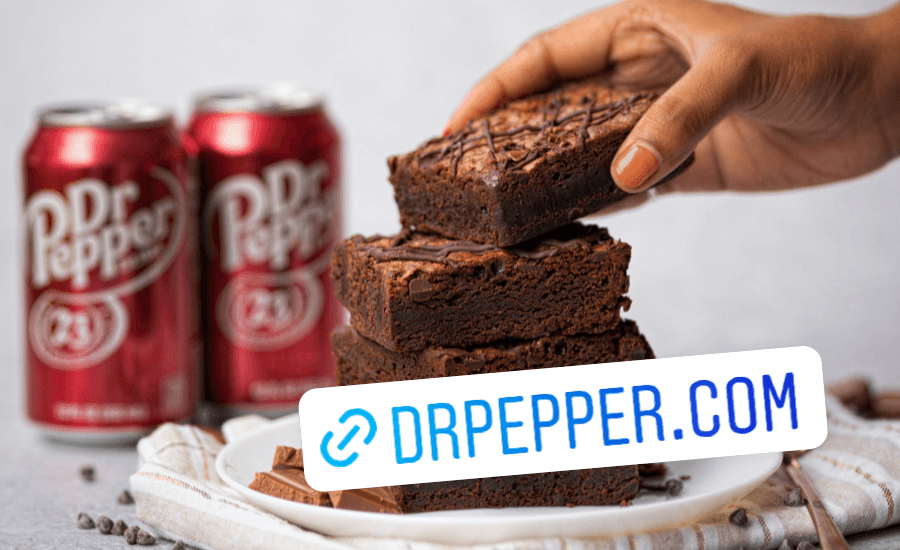 A person picks up a brownie from a stack with Dr Pepper in the background and an Instagram Link Sticker in the bottom right corner that reads 