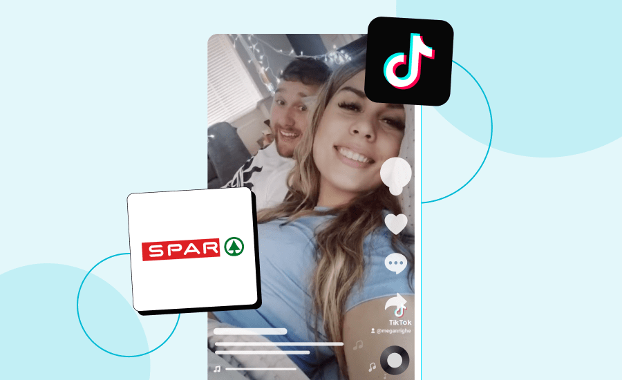 Screenshot of a TikTok featuring a woman and man smiling at the camera while lying down