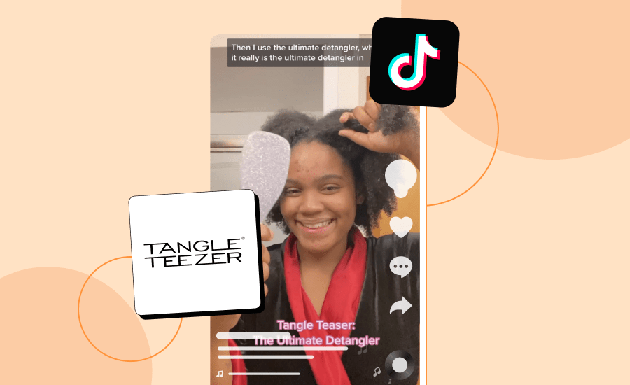 Screenshot of a TikTok of a woman holding a brush and smiling