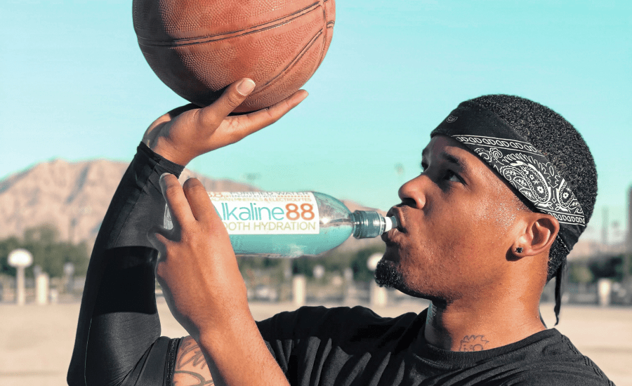 Man drinks will shooting for a goal